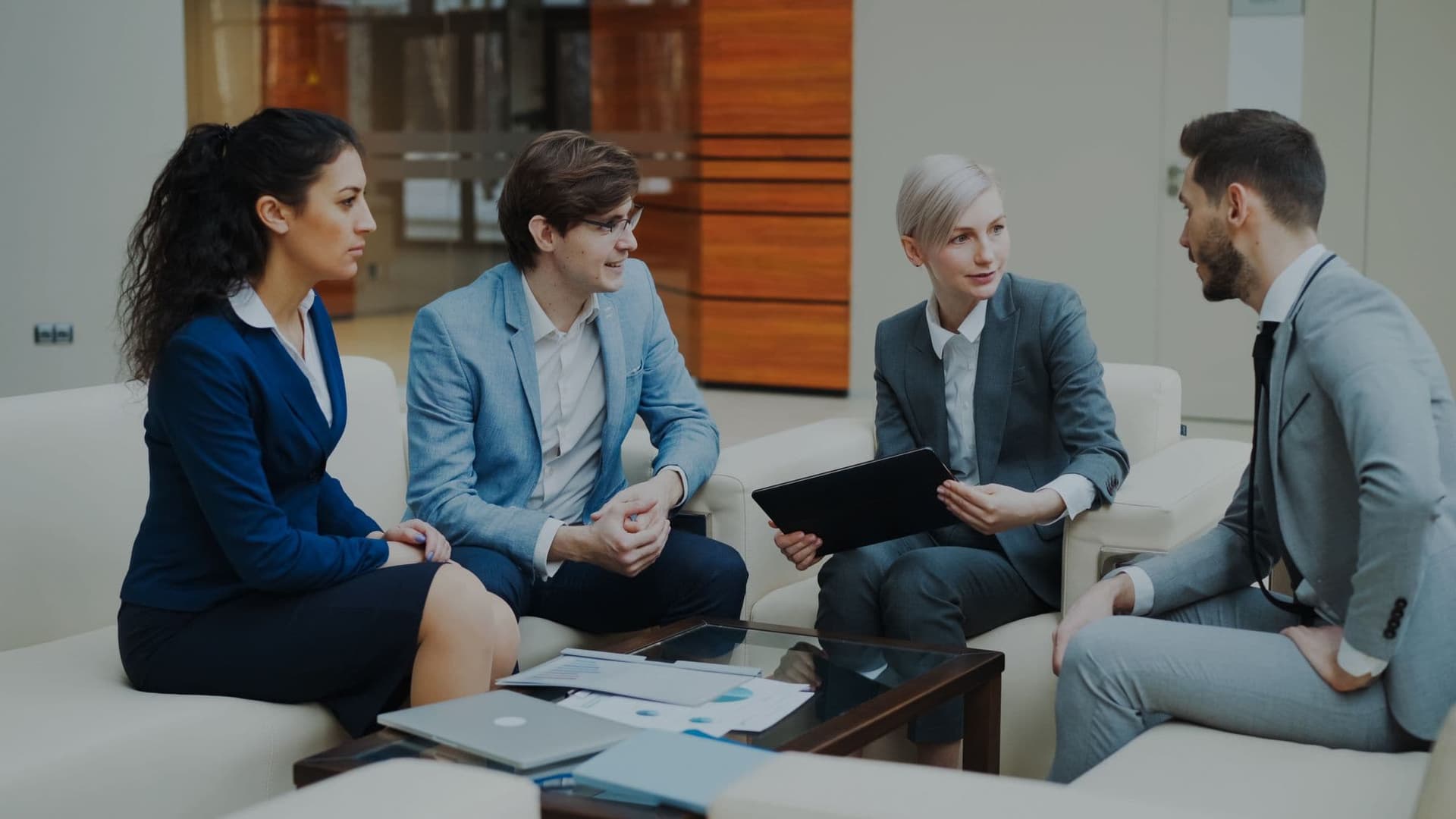 Professionals discussing strategy at an office