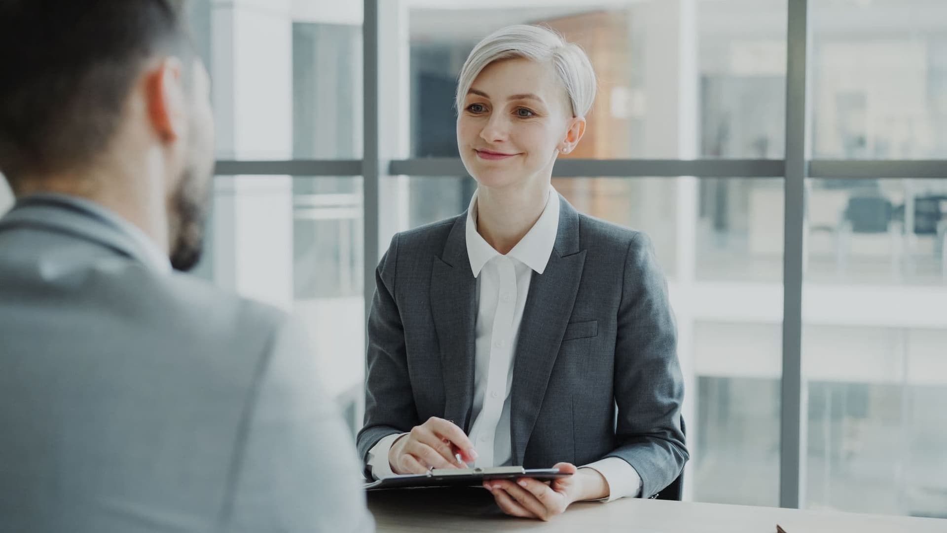 Manager interviewing a candidate in a modern office